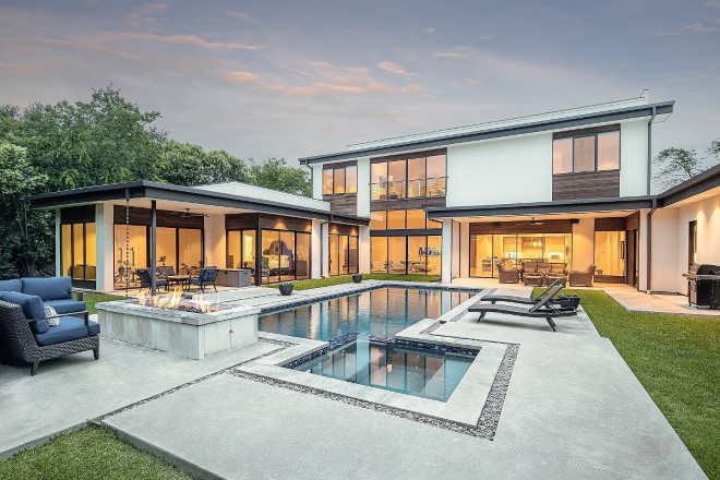 The back of a parge house and its pool area at 345 Excalibur Way